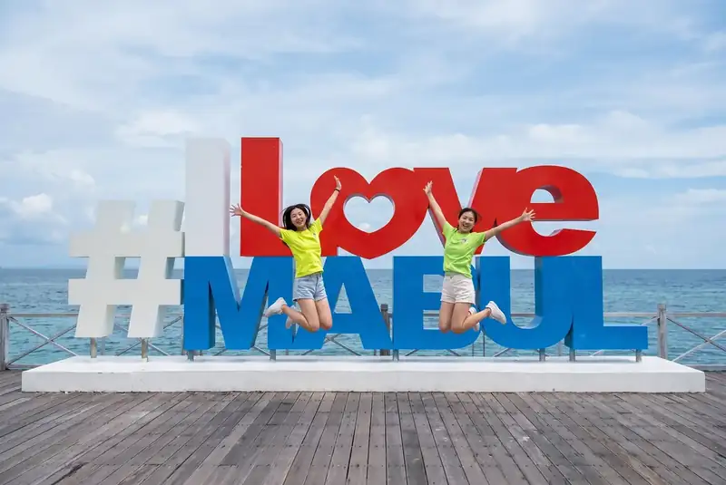 Famous photo spot at the I Love Mabul sign on Mabul Island Crystal Resort