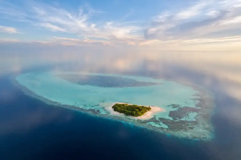Pristine white sand beach at Mantabuan Island Crystal Resort