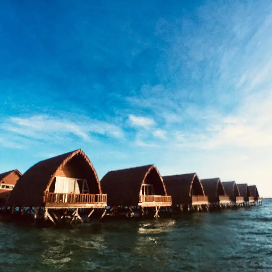 View of the wooden overwater chalets at Crystal Resort