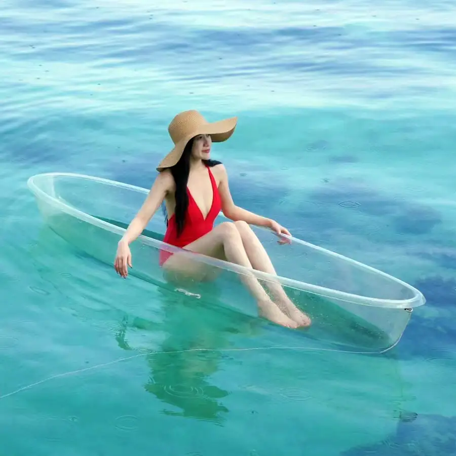 Guest enjoying sea kayaking in the calm turquoise waters Crystal Resort
