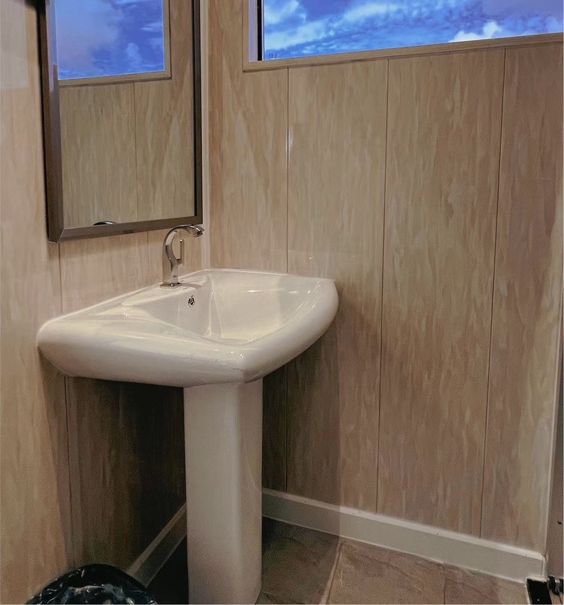 A simple and clean bathroom at Crystal Resort, an overwater resort in the Semporna Islands area